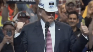Donald Trump wears a miner’s helmet given to him by supporters at a 2016 campaign rally in West Virginia. Courtesy of Media Education Foundation.